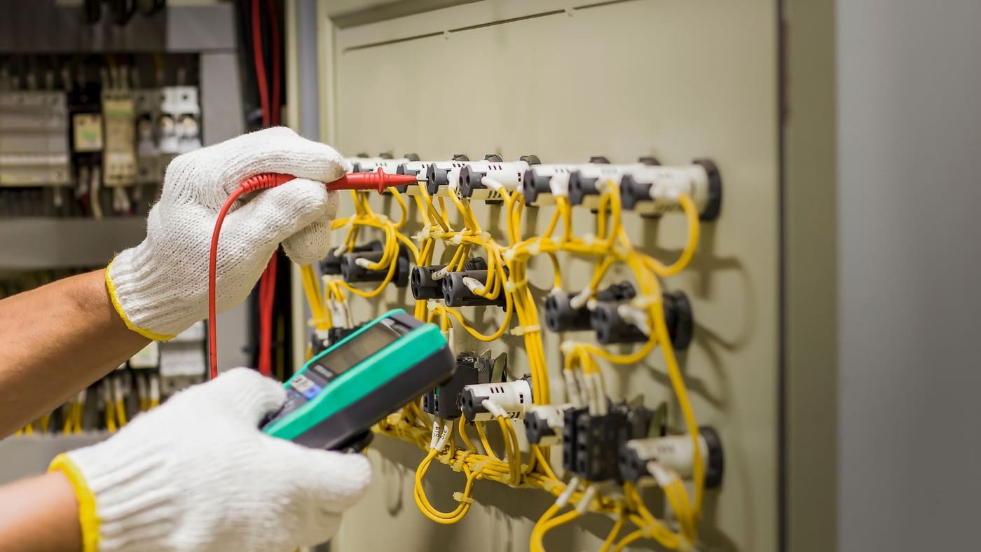 Close-up of circuit testing at an electrical distribution panel