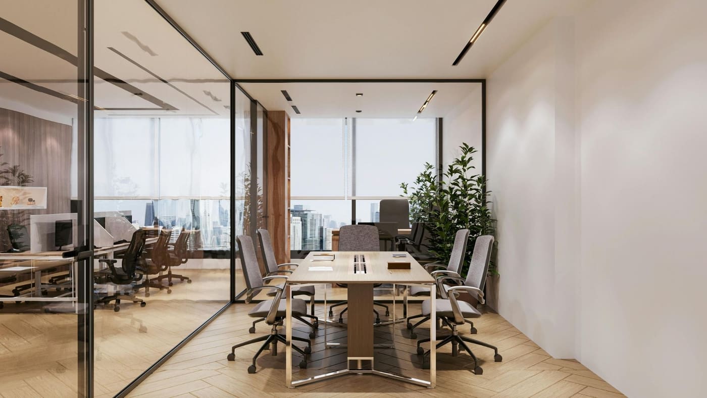 Glass-walled conference room with skyline views and integrated lighting