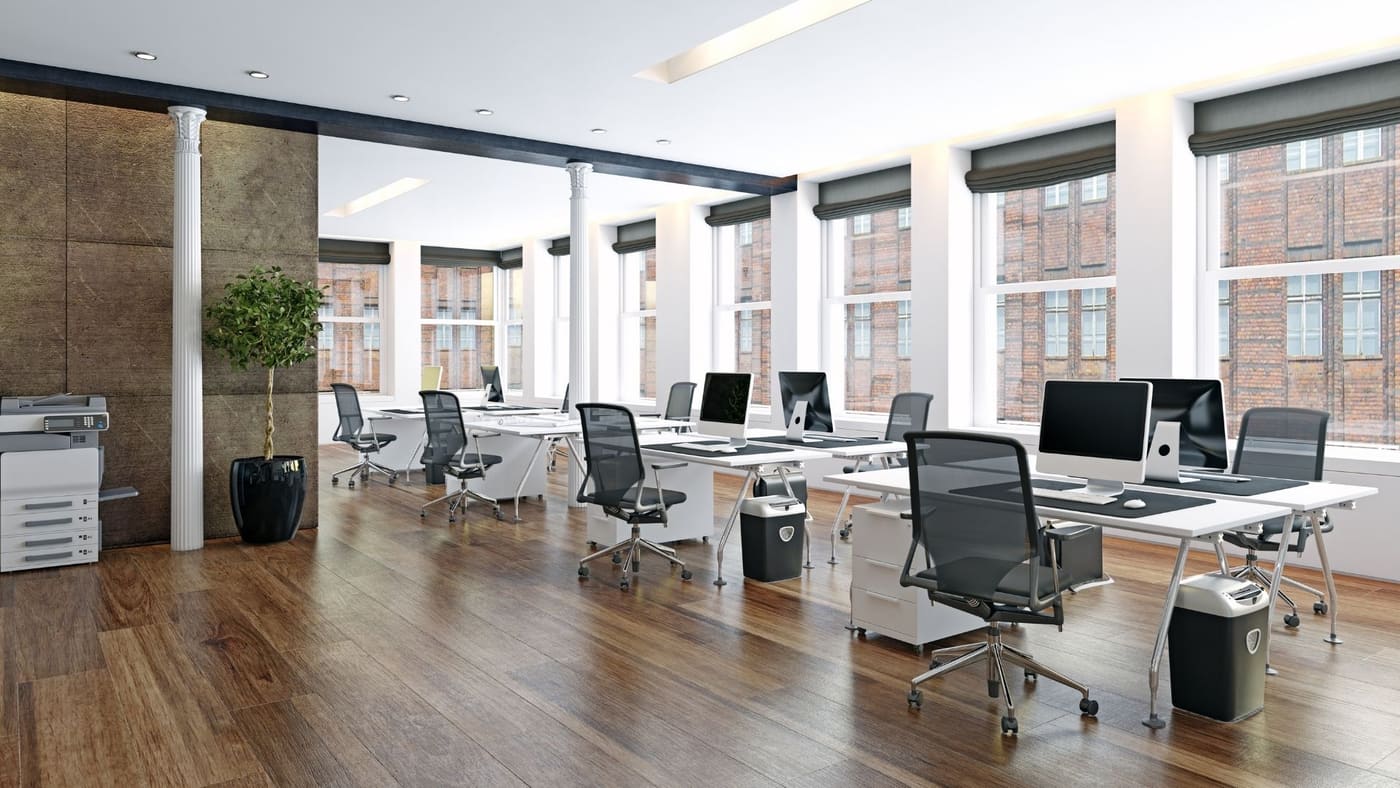 Corporate office floor with workstations and recessed lighting