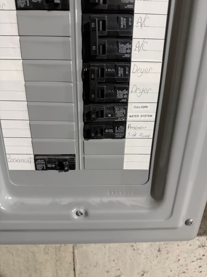 Fresh breakers landed and every circuit hand-labeled before the panel cover goes back on.