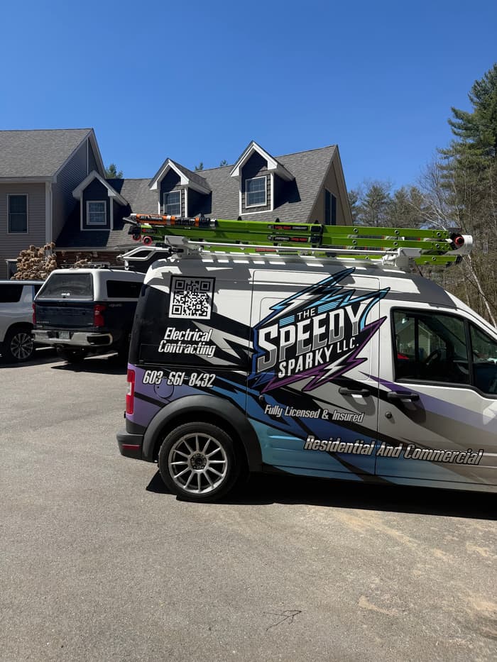 Ladders racked and the van staged in the driveway ahead of a full-day install.