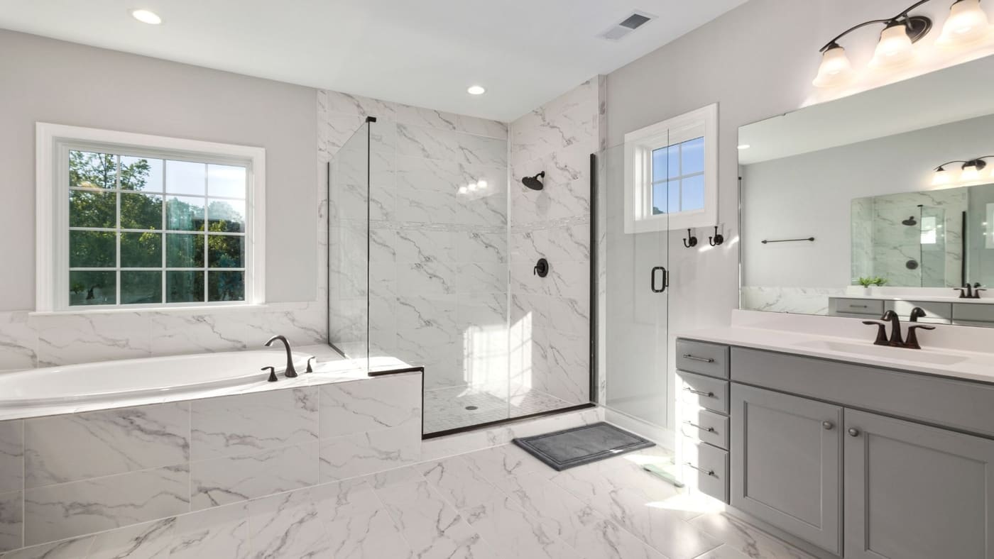 Master bathroom with marble finishes and natural light