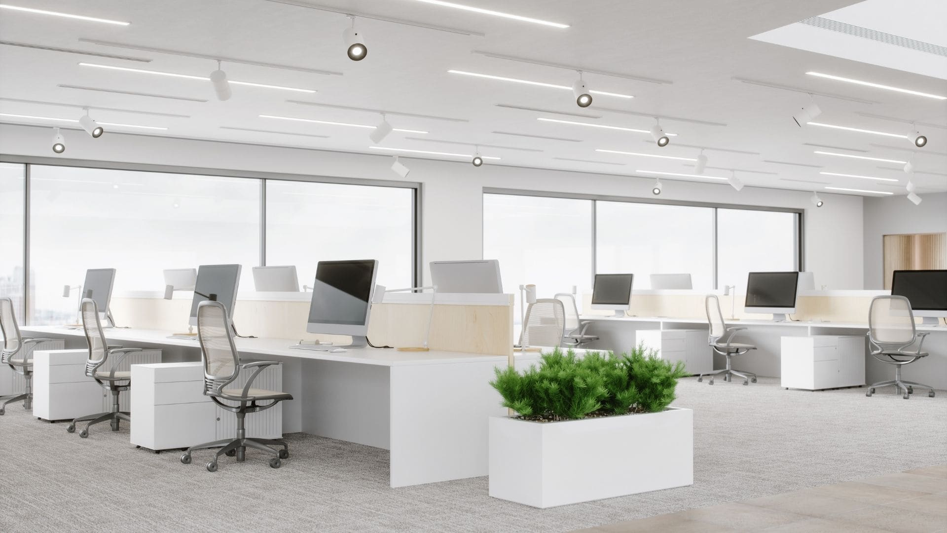 Modern open-plan office with recessed LED ceiling lighting