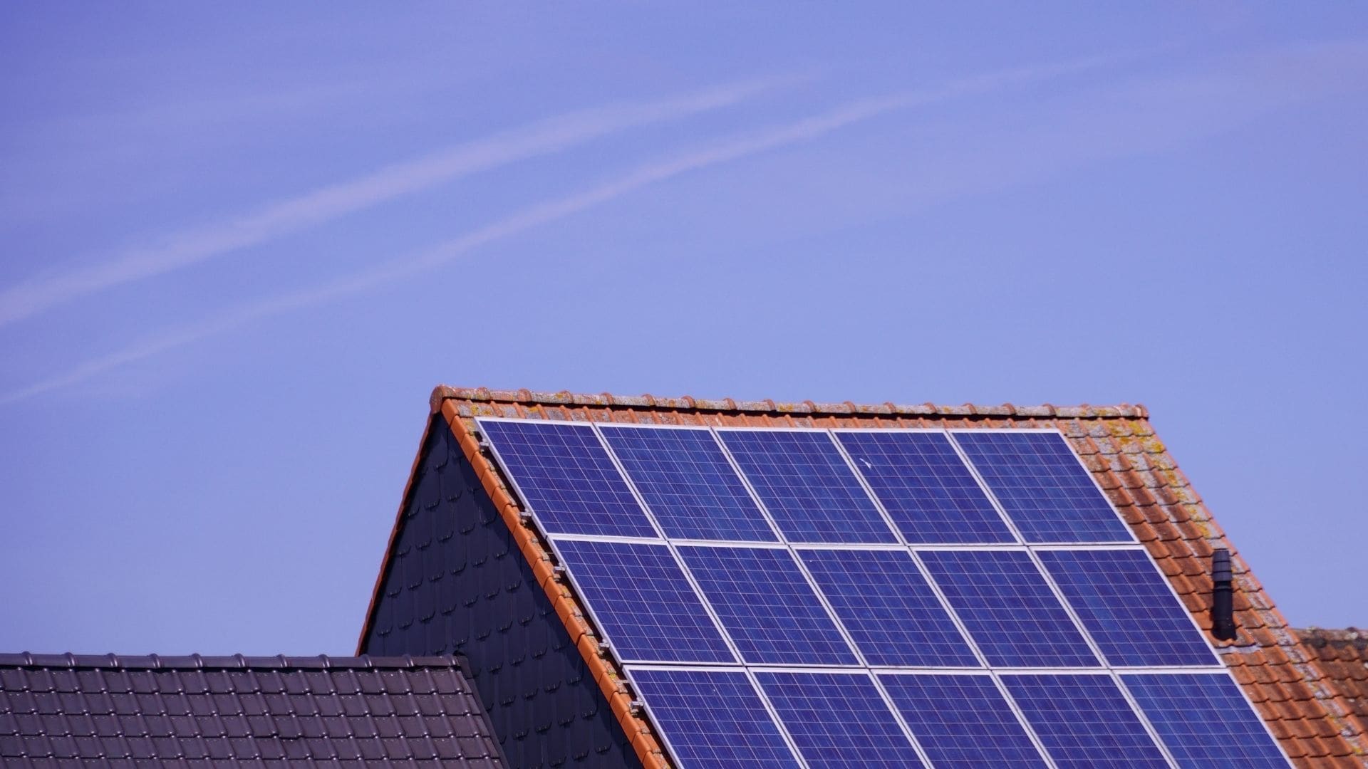 Aerial view of a residential rooftop solar panel array